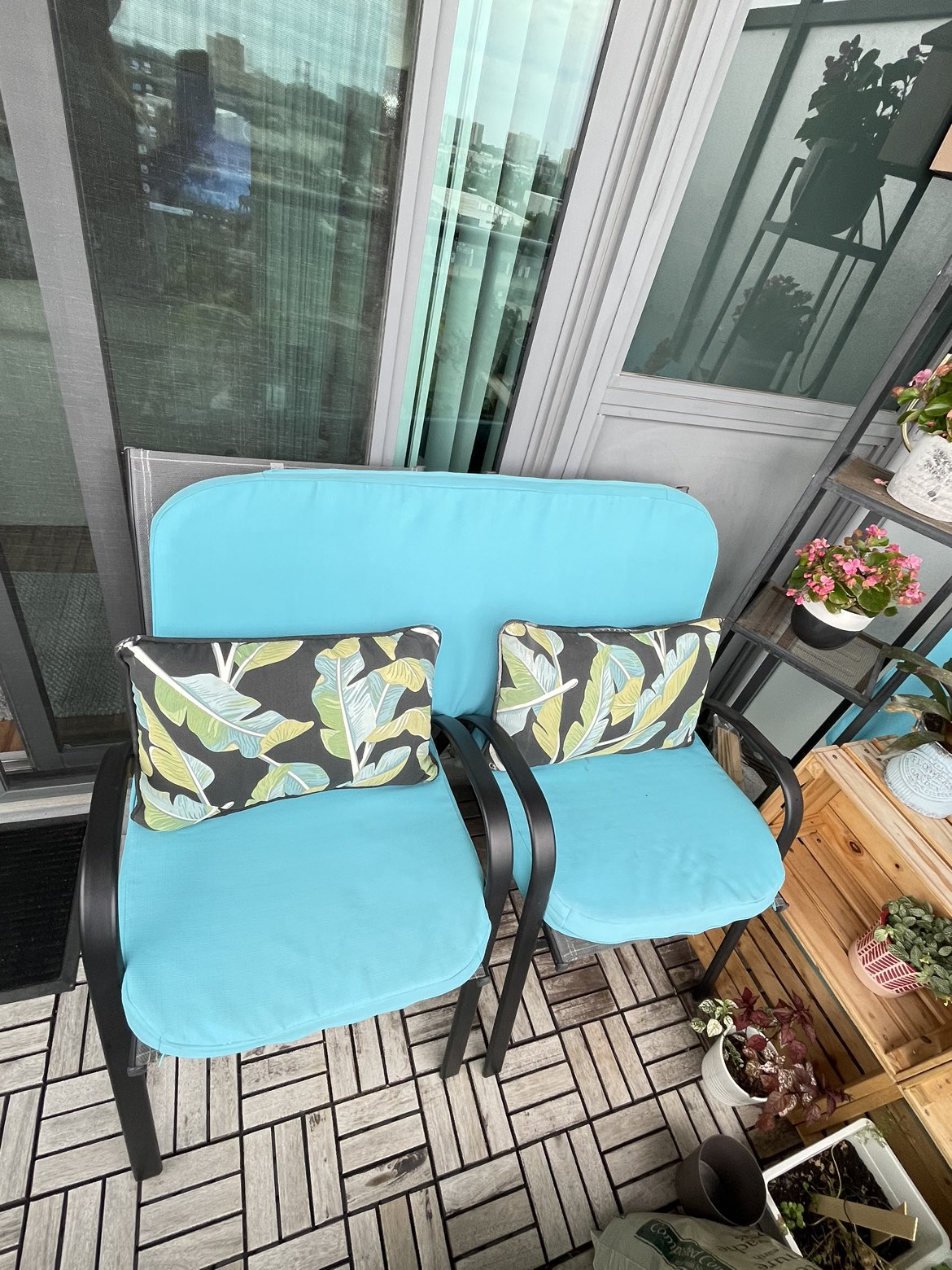 Patio chairs, table, lantern