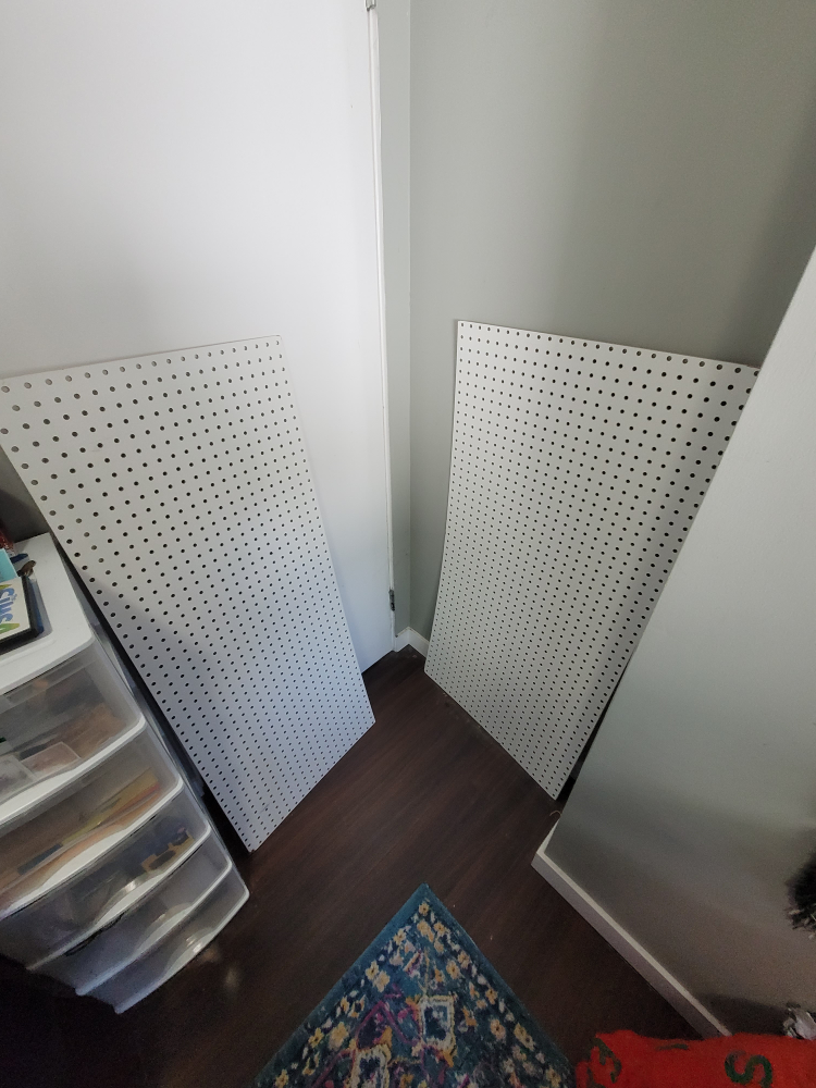 Pegboards with hooks and holders