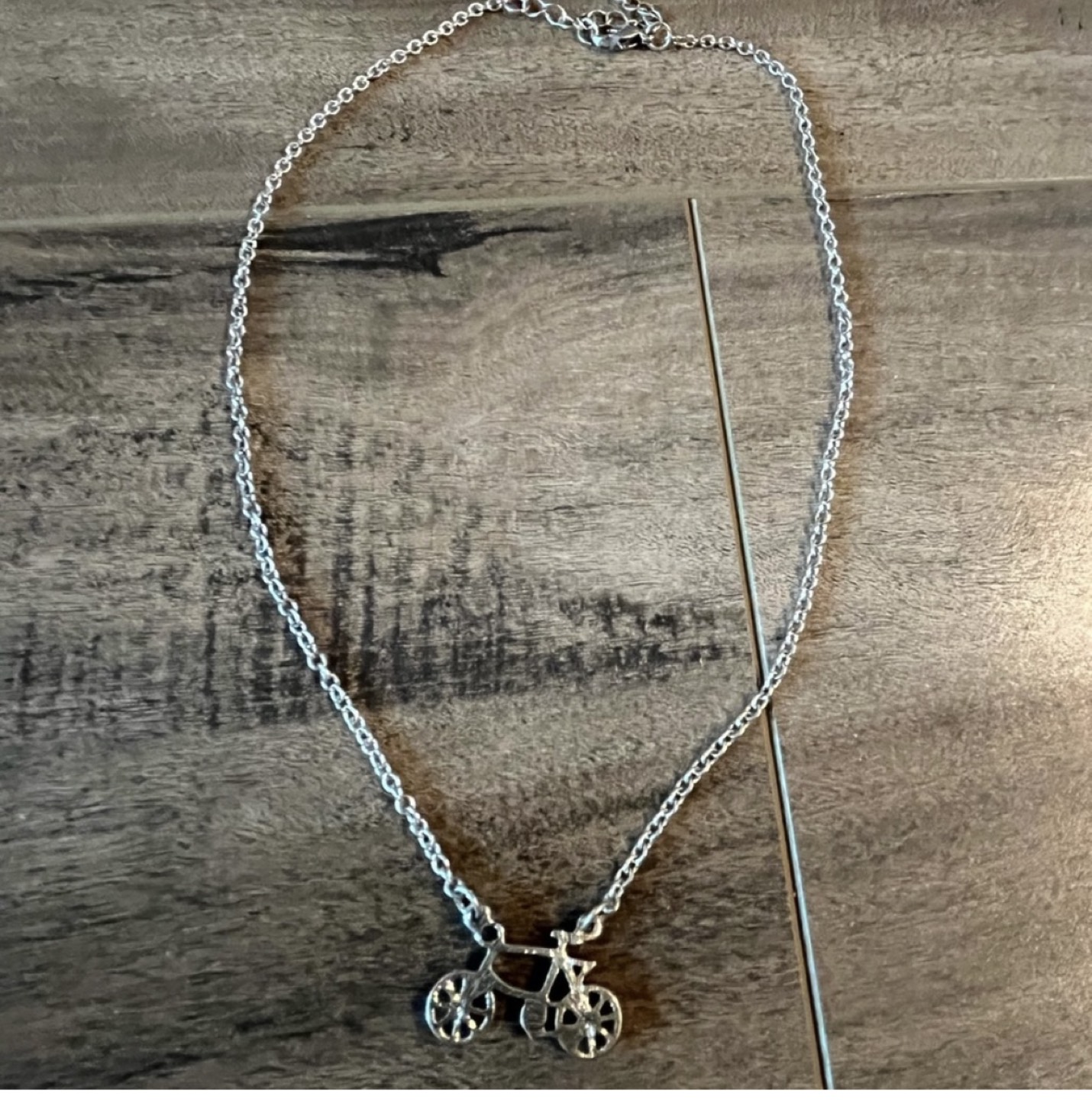 Unique bicycle design necklace- silver toned. Brand new image indicator(2)