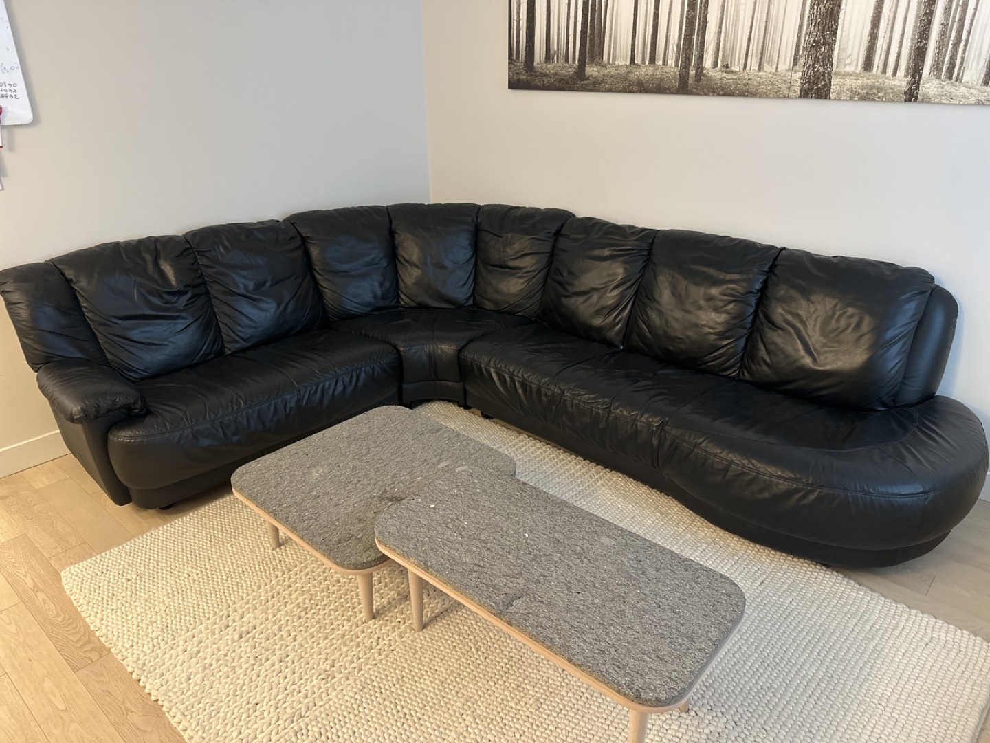 Black leather L-shaped couch
