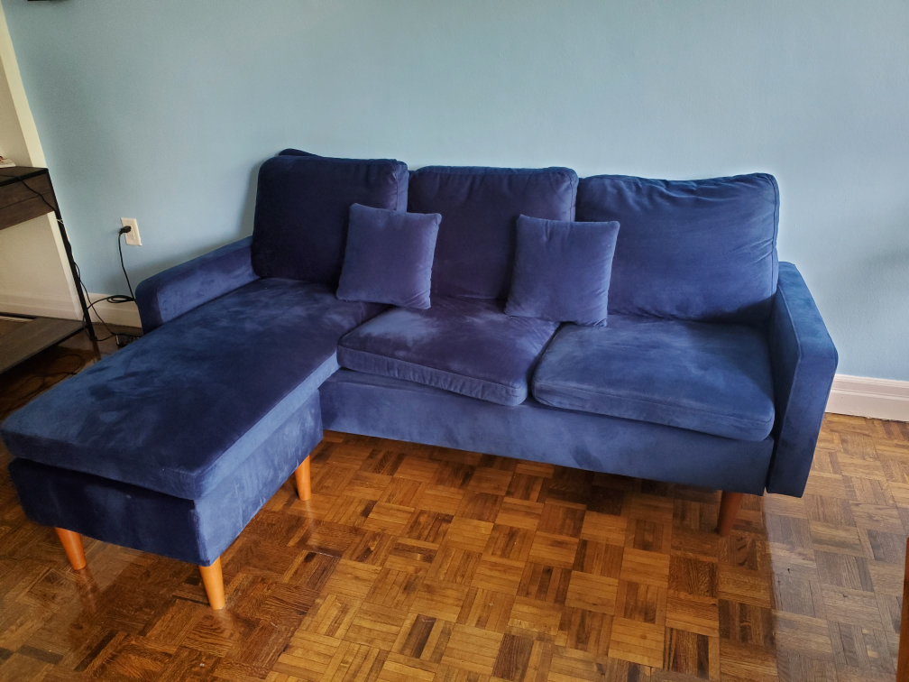 sofa with movable pouffe