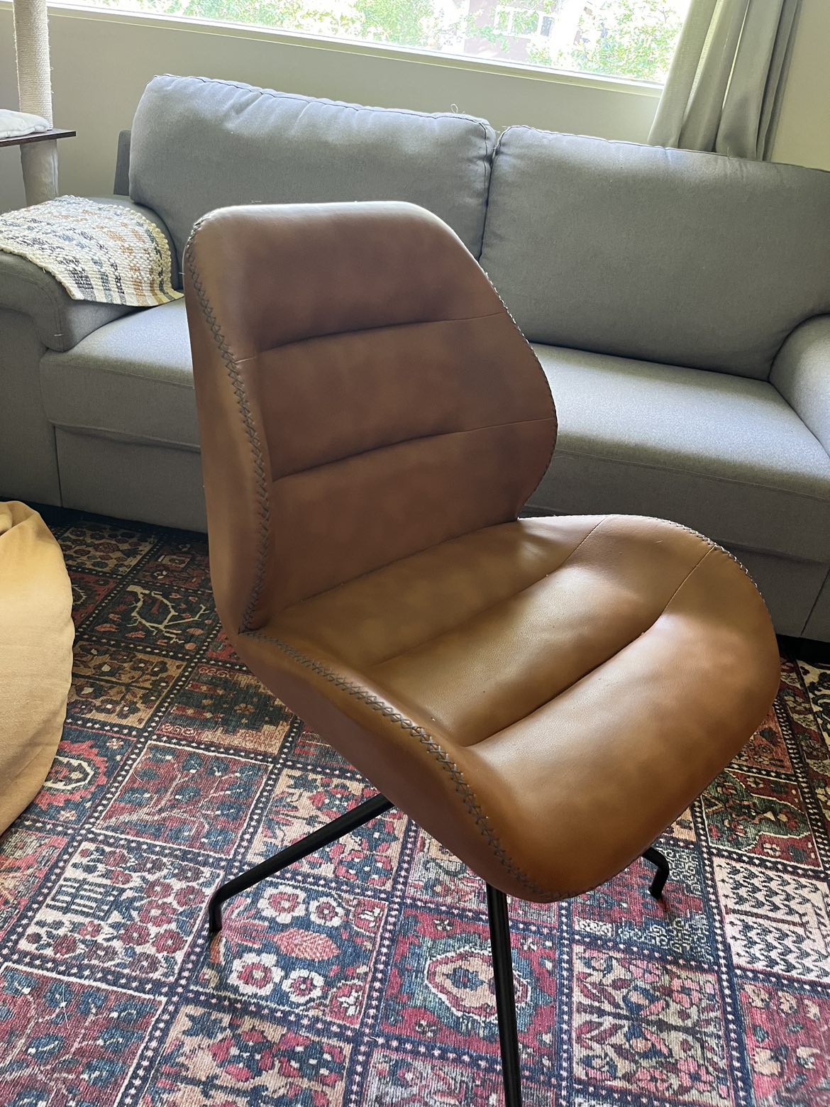 Faux brown leather swivel chair