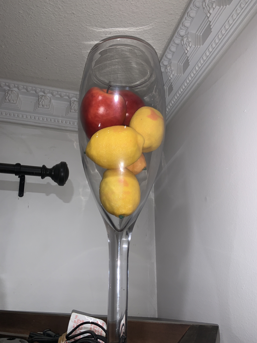 Large glass with fruits inside