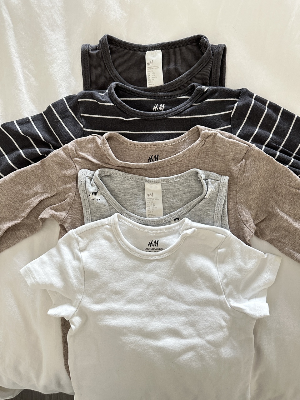 Gently used toddler (neutral-boy) clothes. Many sizes