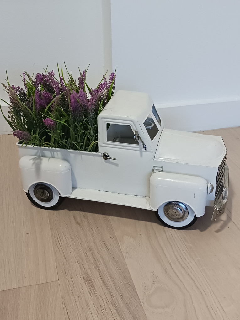 Vintage white metal decortaive truck with faux lavender flowers