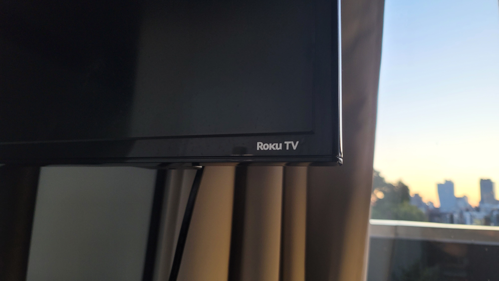 32 inch smart Roku TV with TV stand & Rolling TV stand image indicator(4)