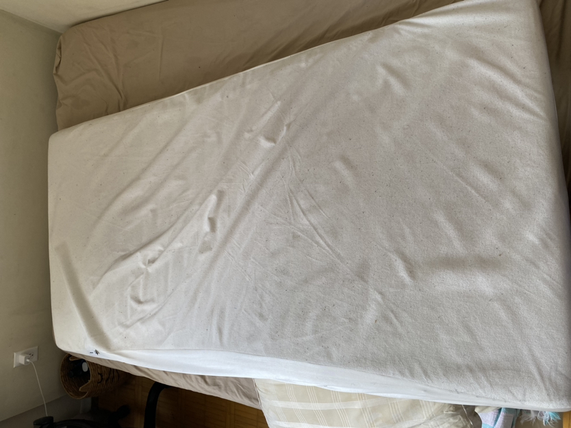 IKEA twin bed with mattress protector