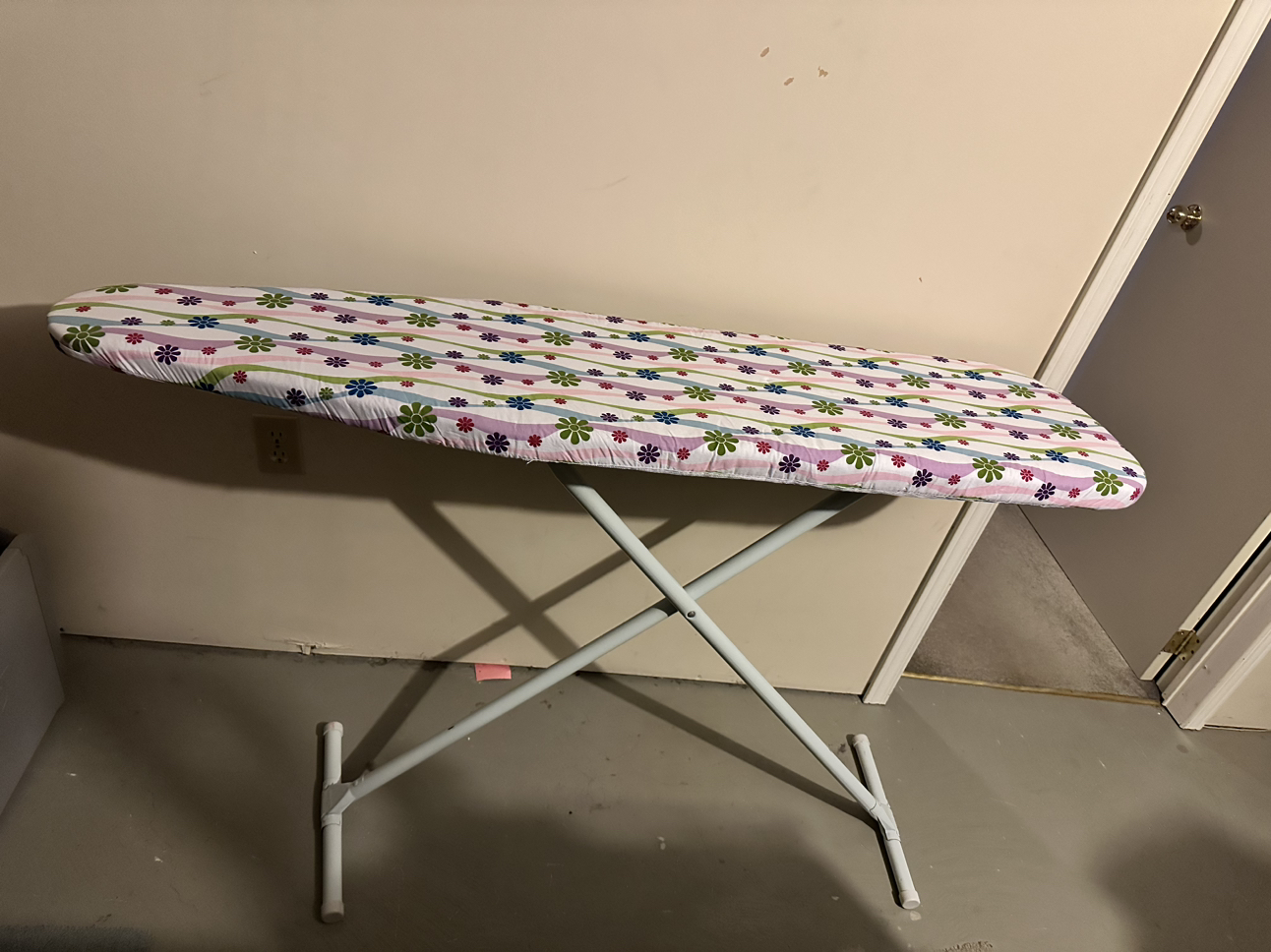 Ironing board with like new pad and cover