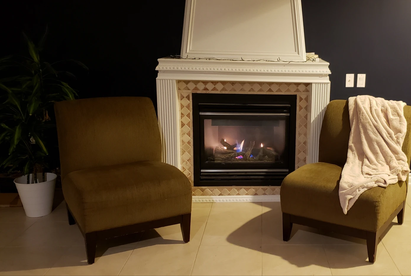 Two big size dark brownish olive green comfortable chairs.