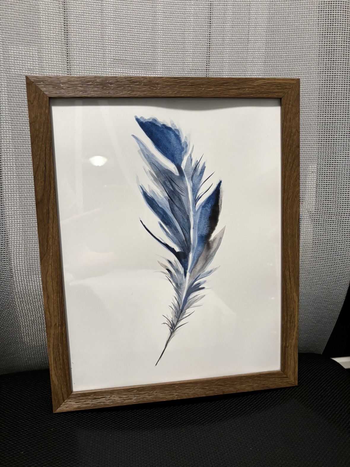Wall art/picture of a blue feather with wooden frame