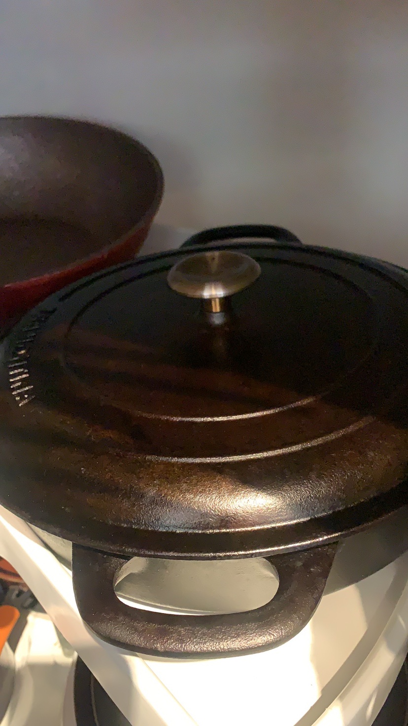 Black cast iron casserole pan