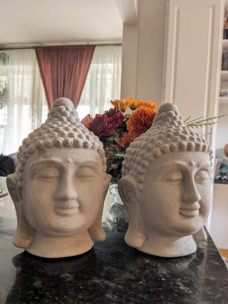 Two cement Buddha heads thumbnail