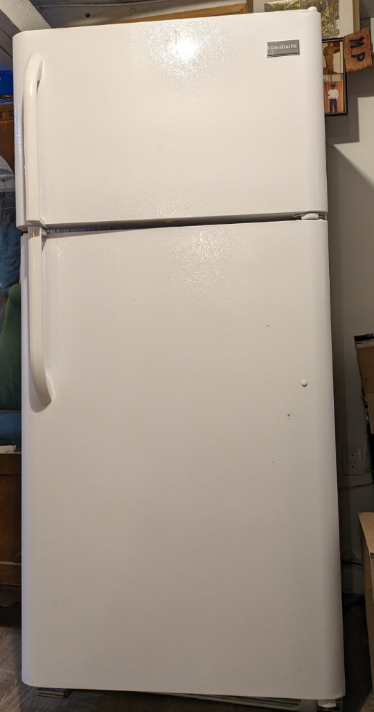 White Frigidaire brand refrigerator