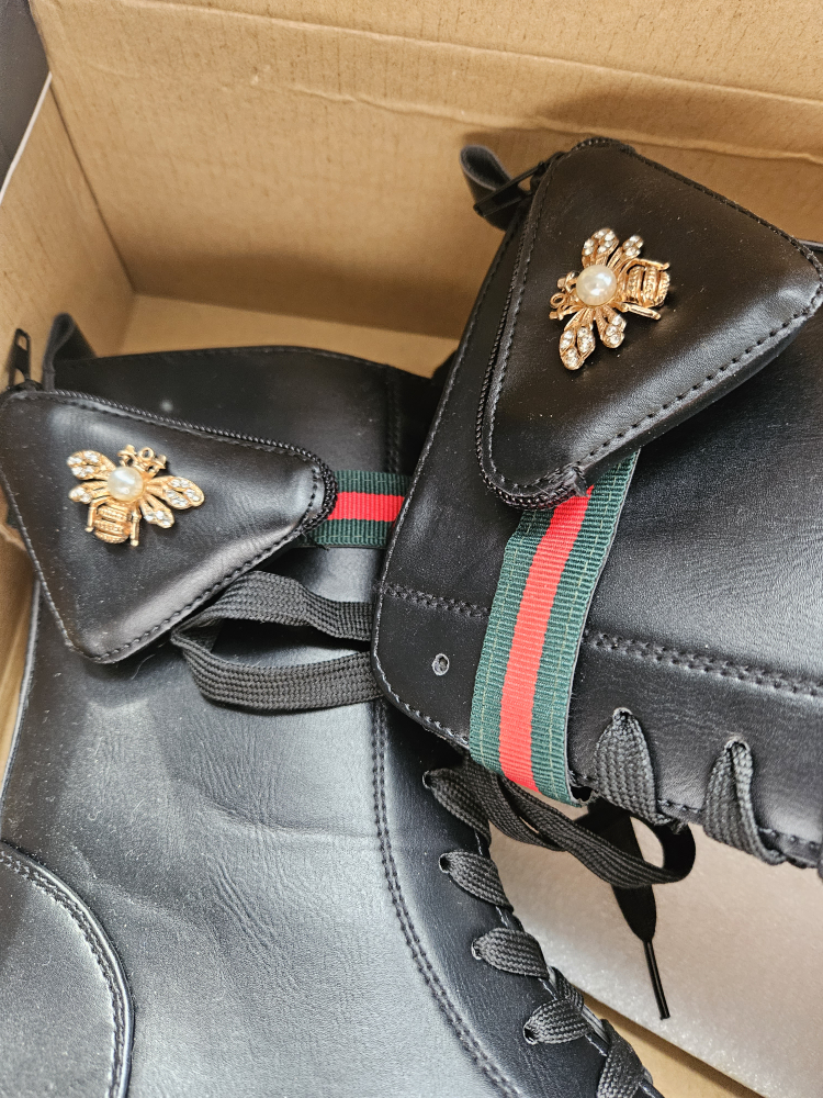 Black combat boot. image indicator(4)