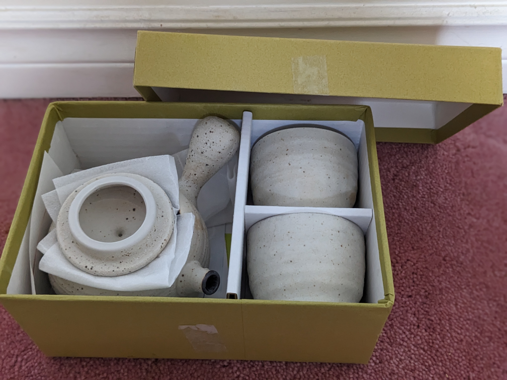 Japanese ceramic teapot with two cups image indicator(2)