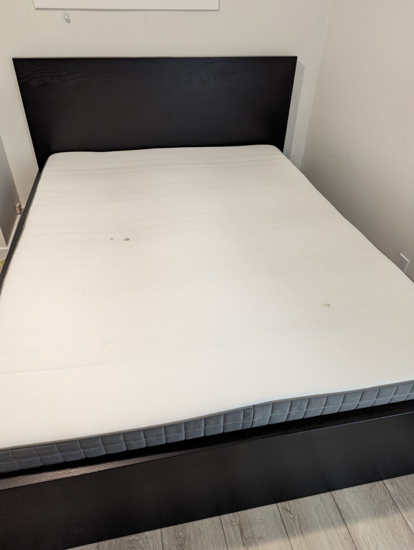 Ikea bed with mattress.