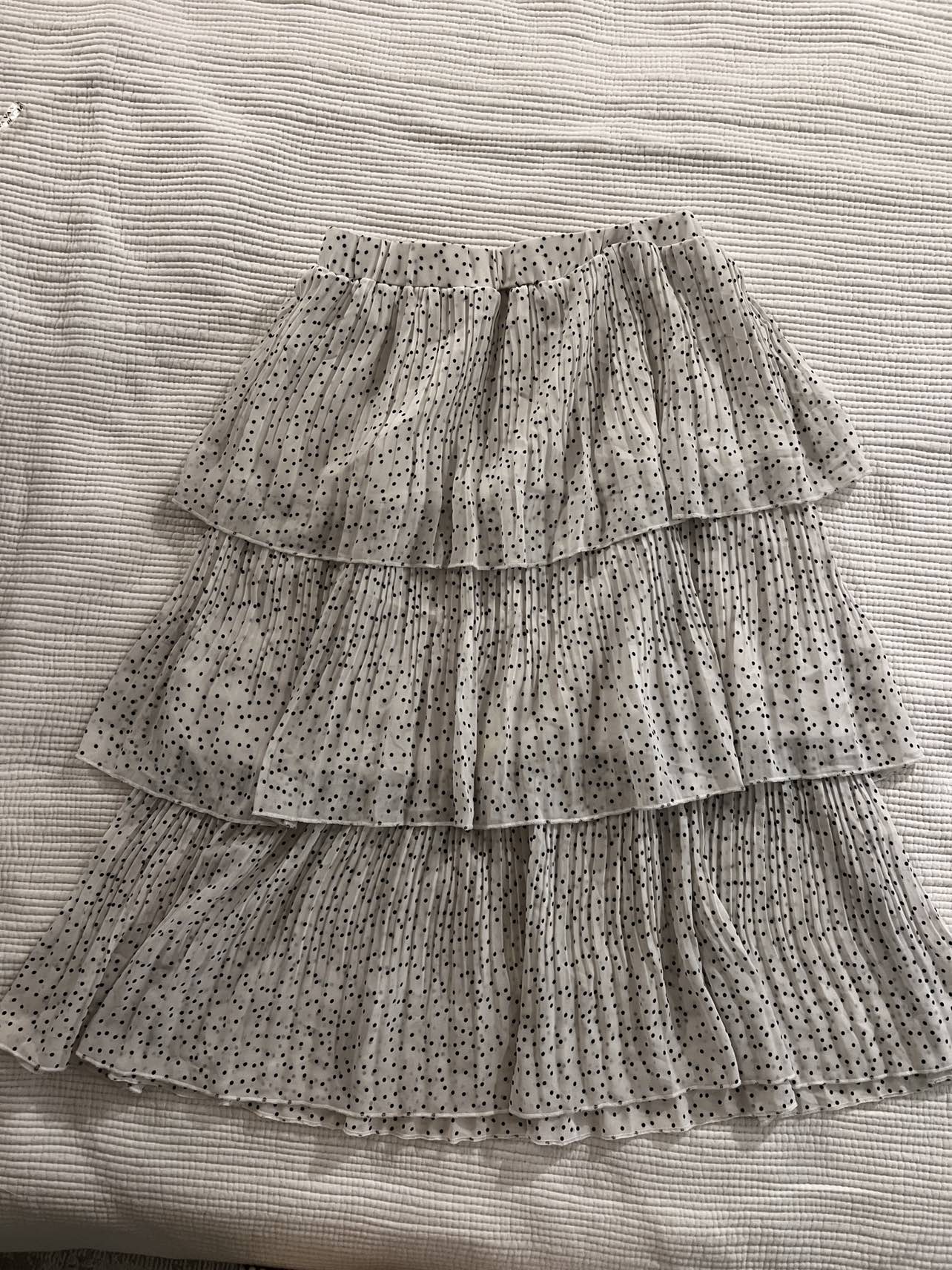 White with black polka dot skirt