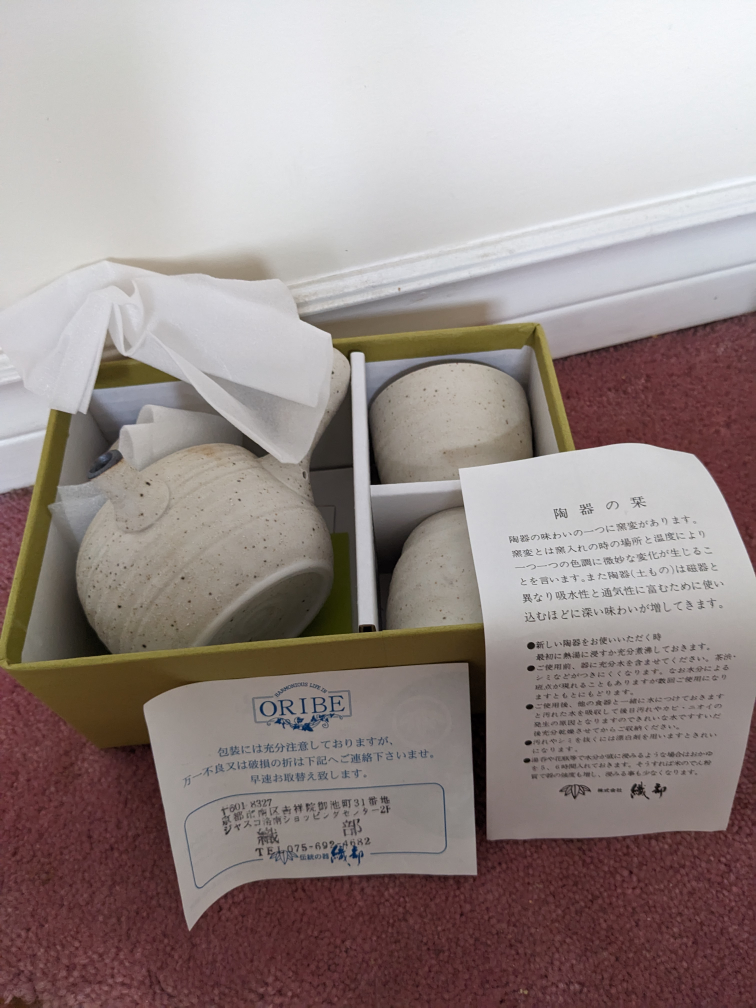 Japanese ceramic teapot with two cups image indicator(3)