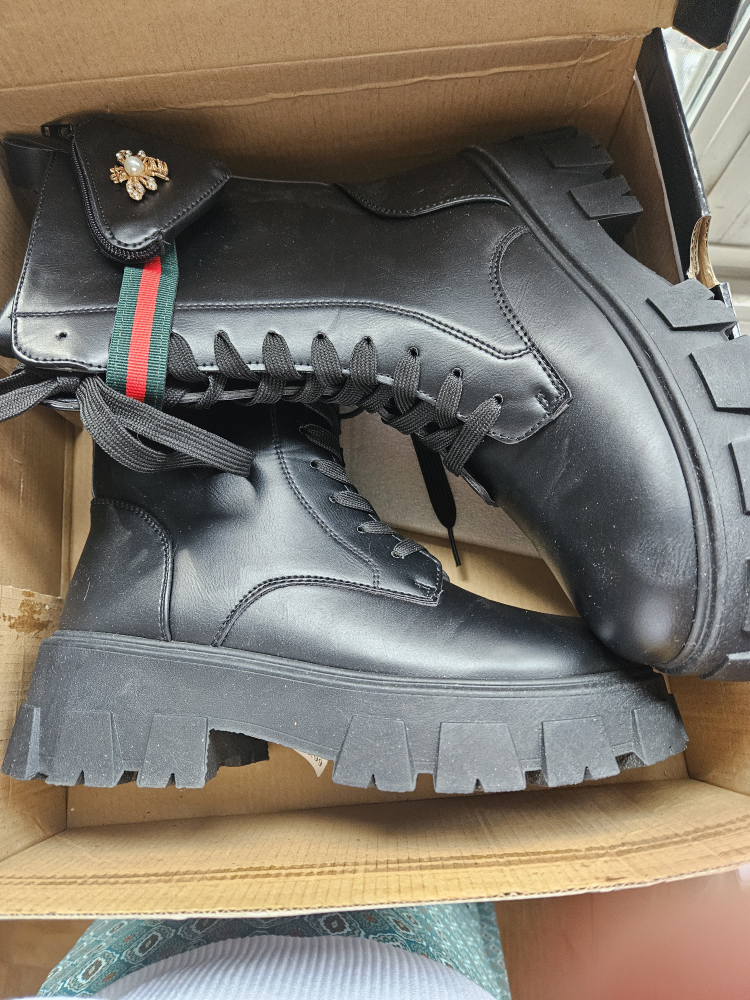 Black combat boot. image indicator(2)