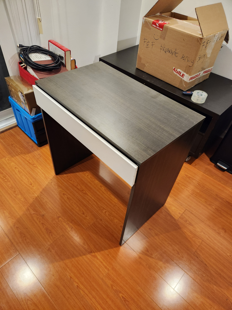 Makeup vanity table with flip-top mirror