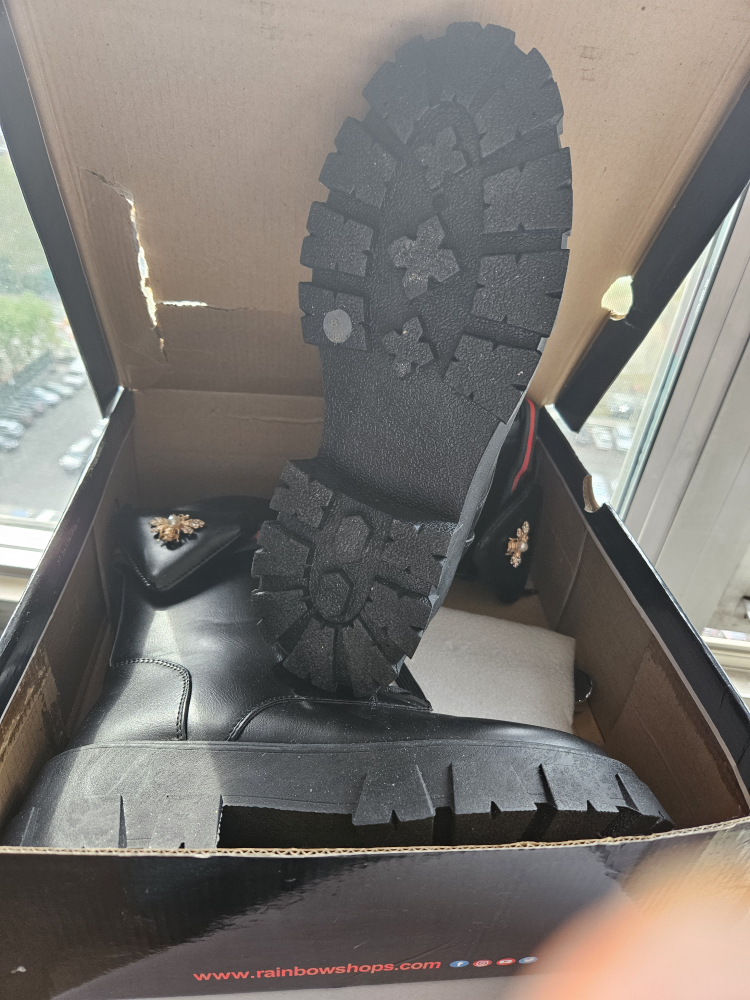 Black combat boot. image indicator(5)