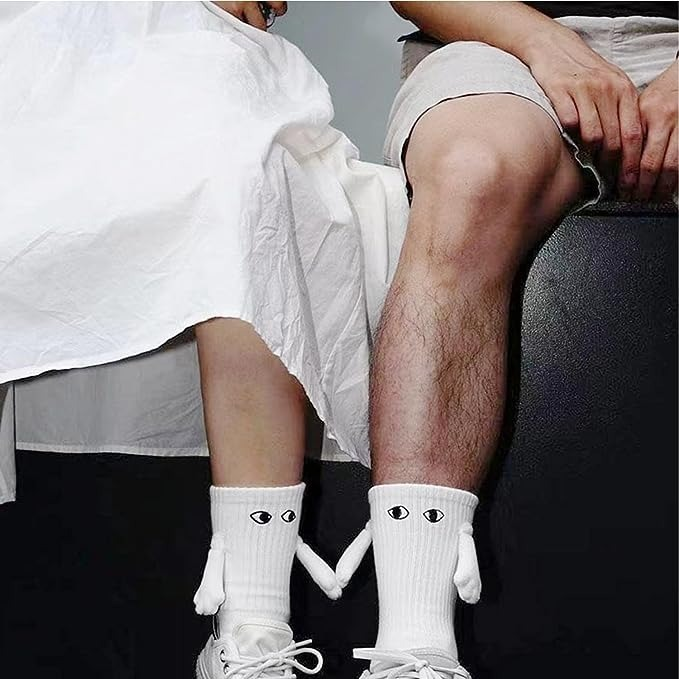 2 pairs of hand holding socks image indicator(2)