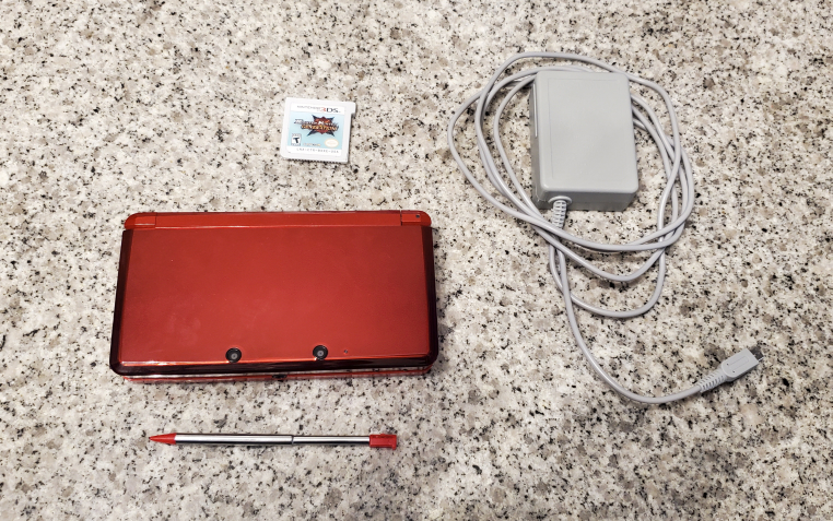 Nintendo 3DS (Flame Red) and Game bundle thumbnail