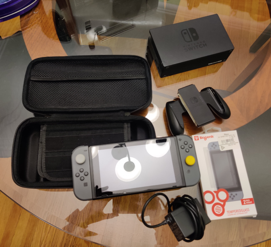 Nintendo Switch with all accessories and game grip