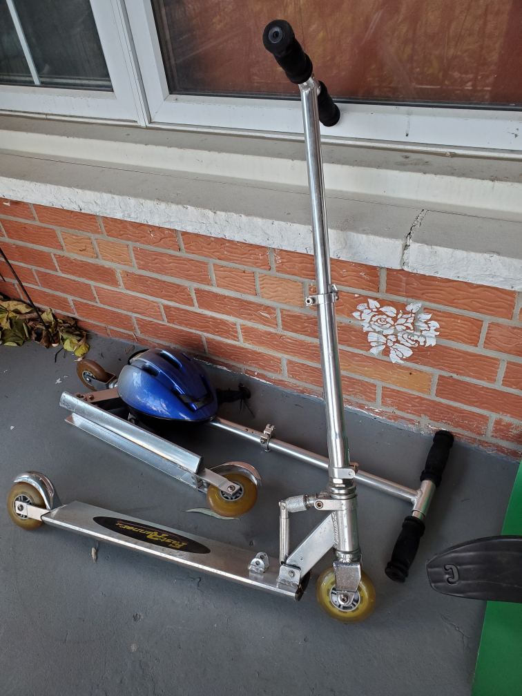 kids scooters, two sets and one small helmet