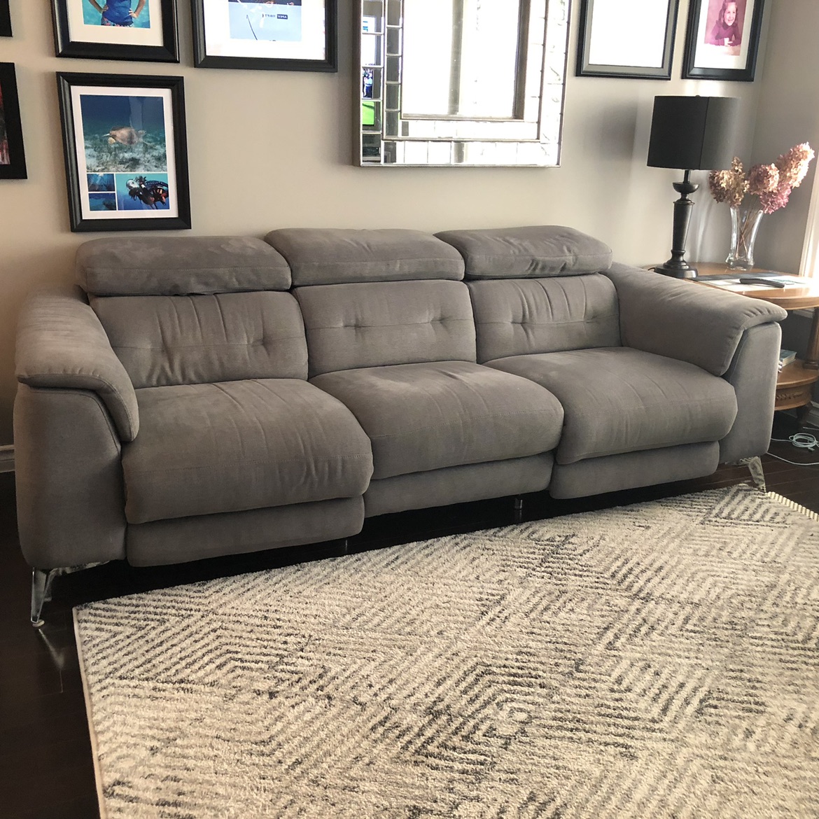 Grey three seater microfibre sofa