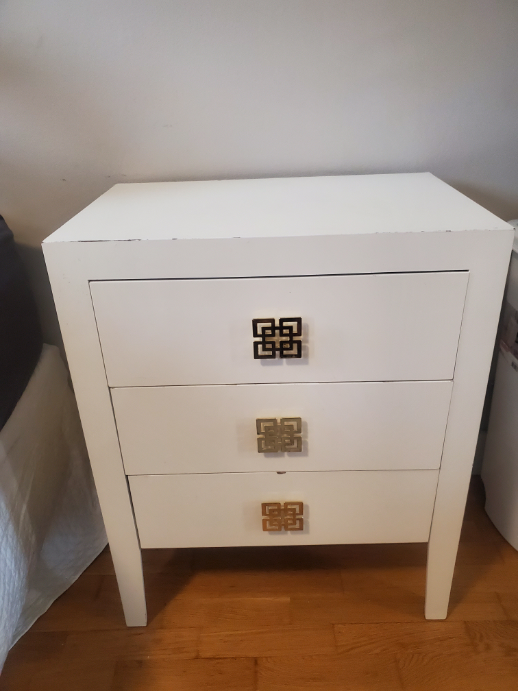 night stand with gold fixtures