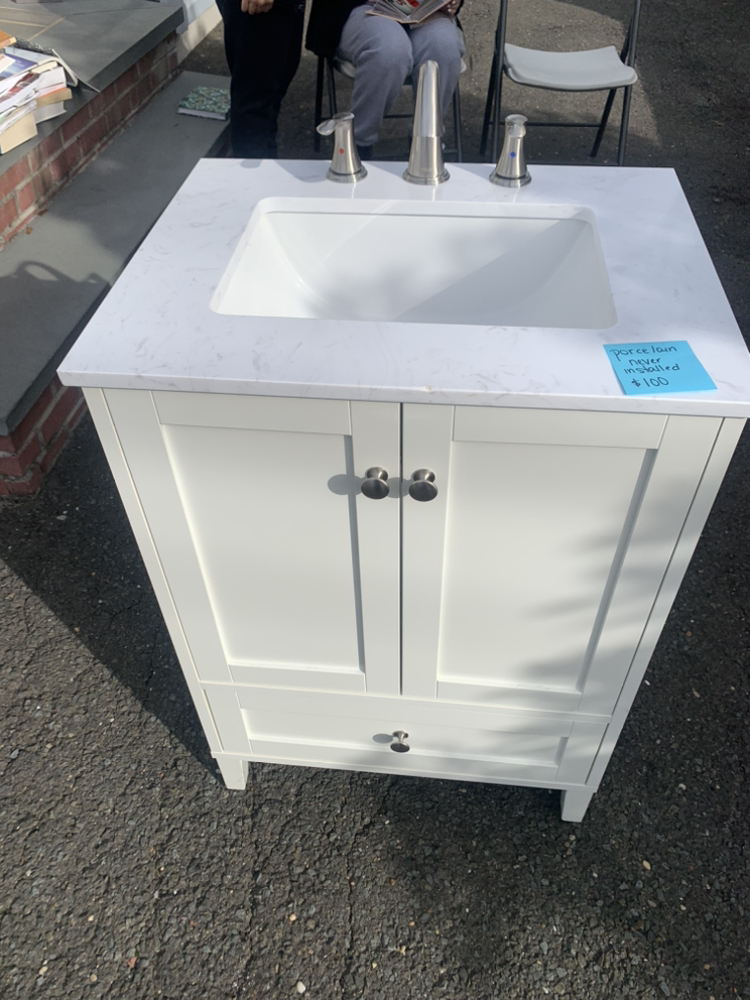 Vanity, sink, and brushed nickel hardware