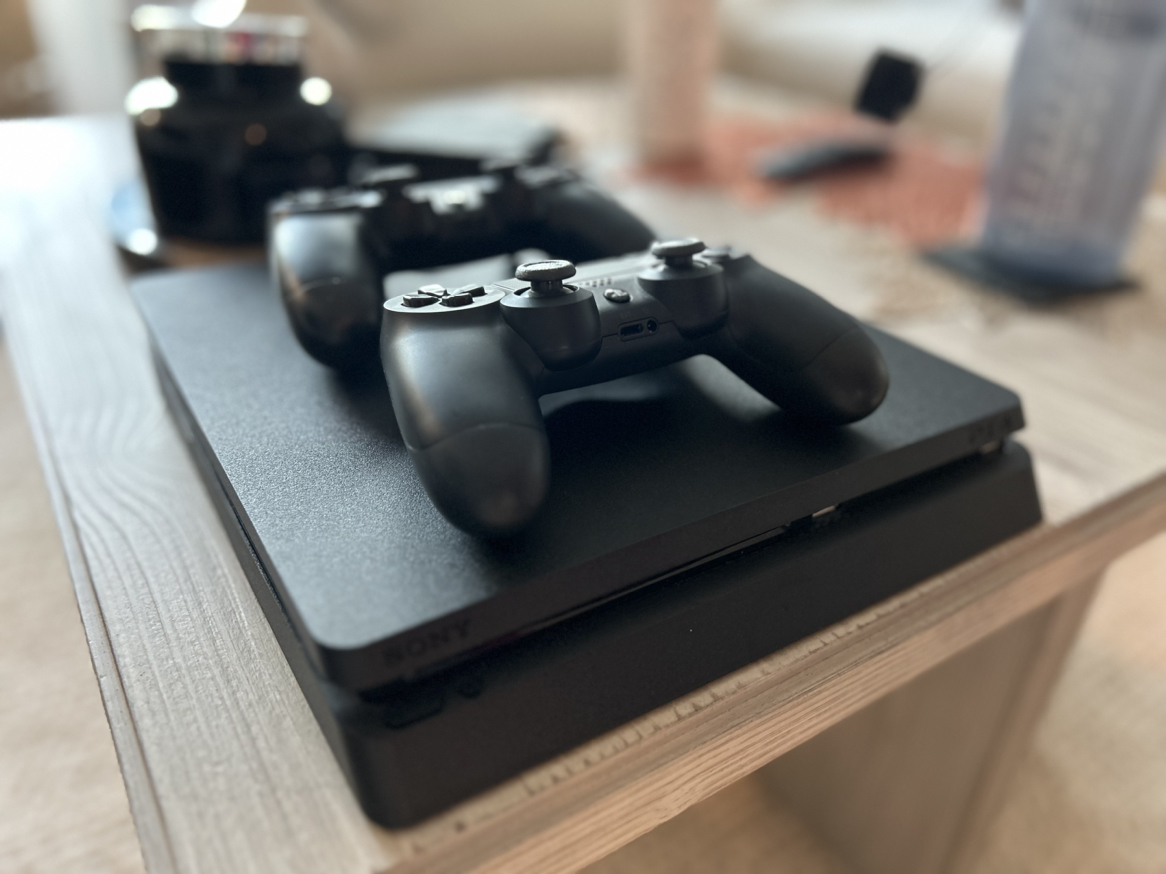 PlayStation 4 Slim (PS4) & two controllers