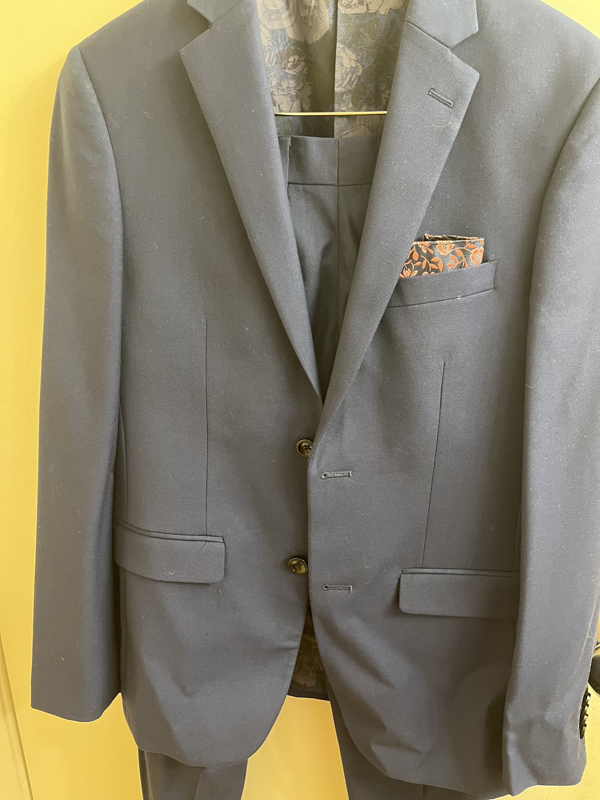 Elegant suit with matching pocket square and white shirt and image indicator(3)