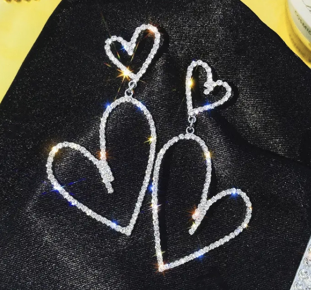Brand new heart ❤️ shaped earrings             Silver left