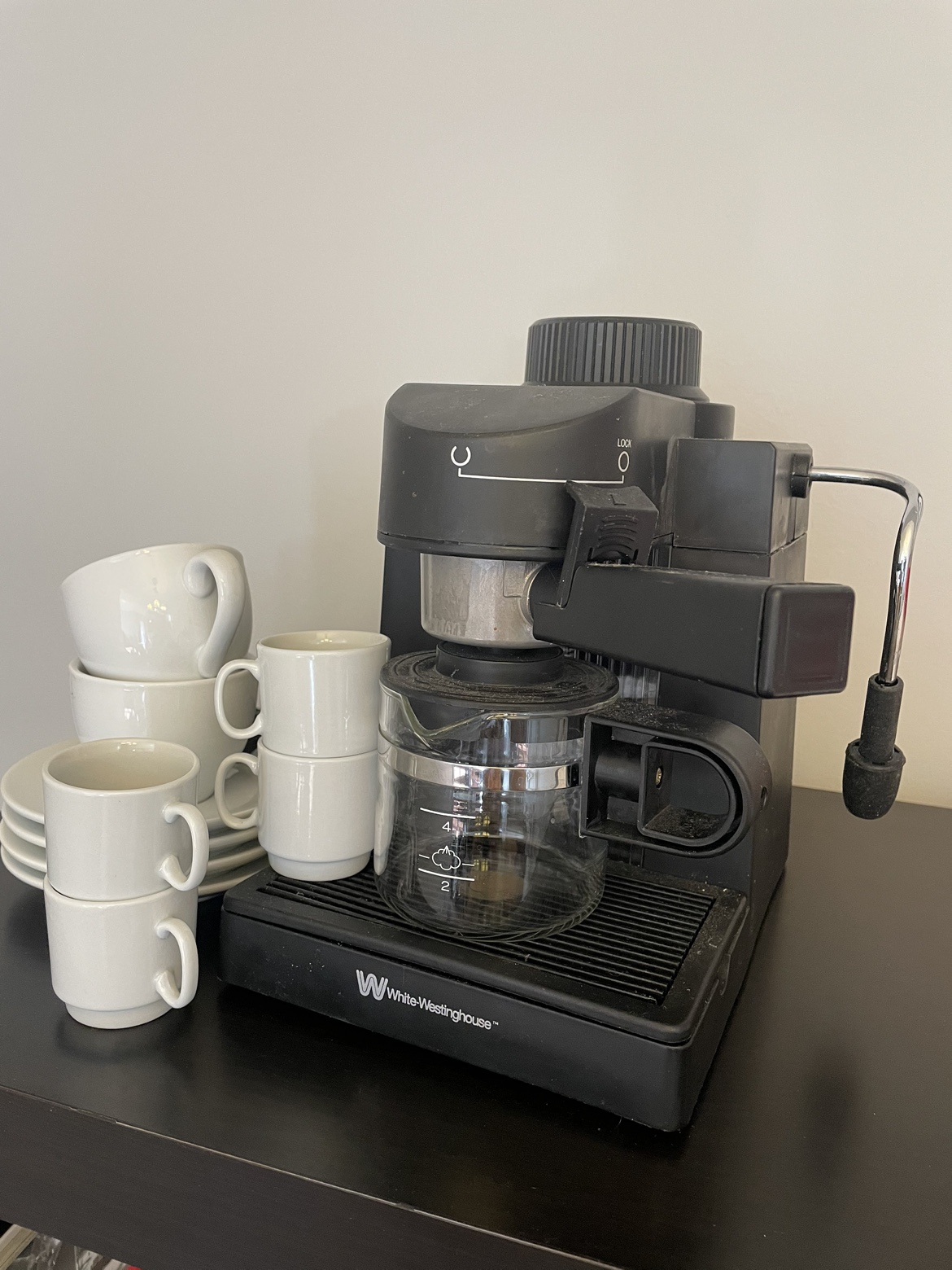 Espresso machine with cups and plates