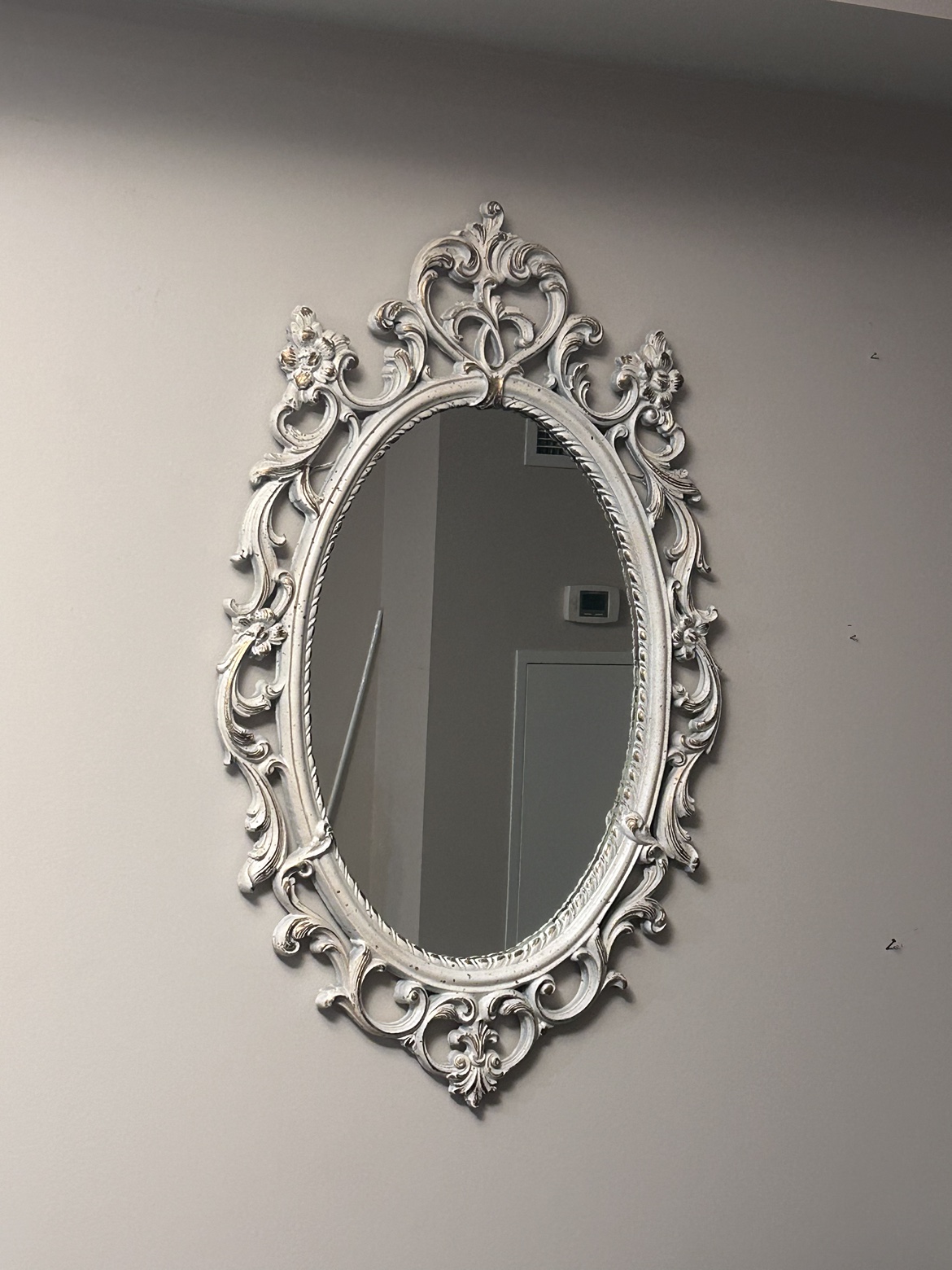 Cream colour oval mirror with gold brush finish