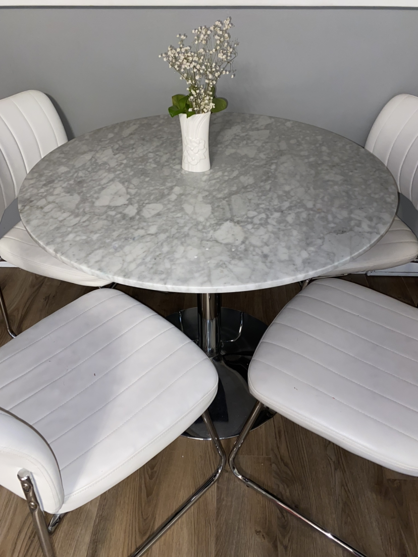 Set of a marble table and 4 chairs.
