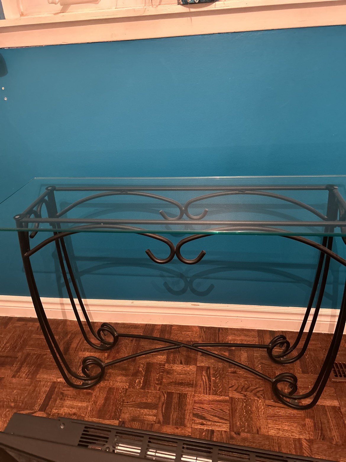 Glass top and cast iron legs side table.