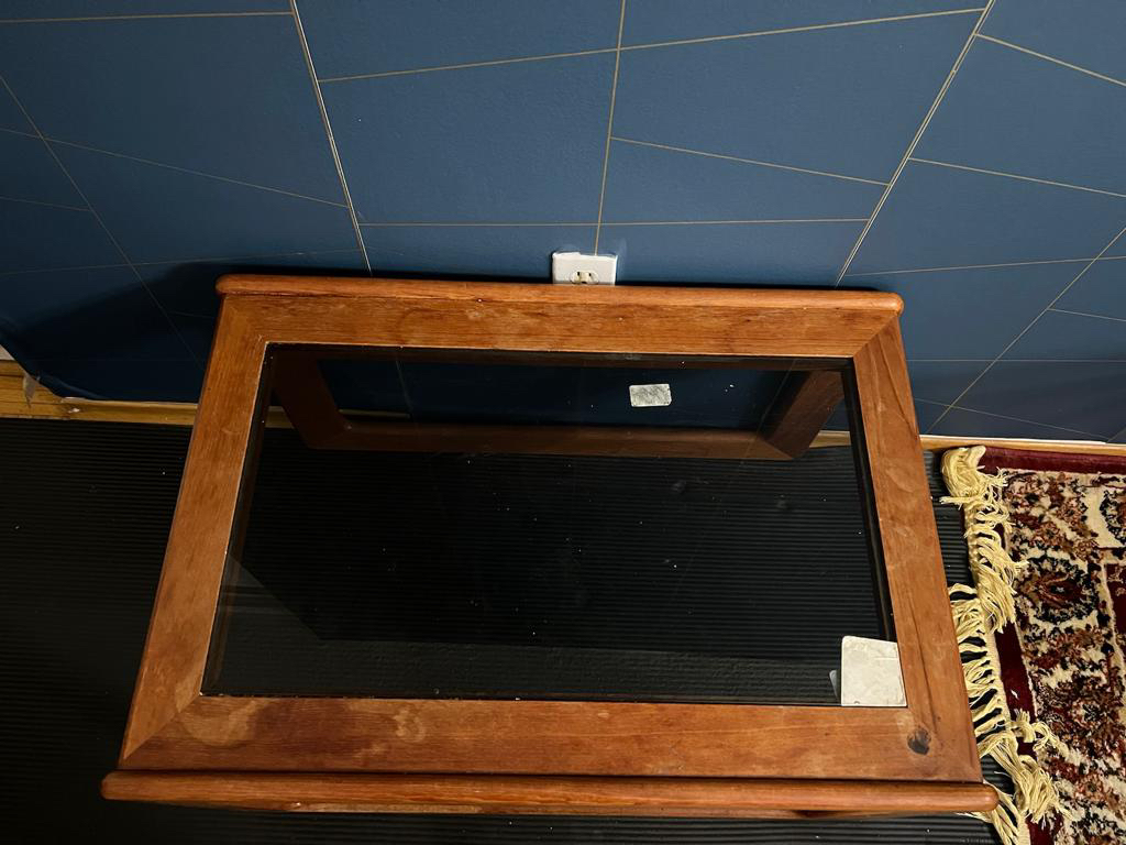 Coffee Table - Wooden body with black glass top