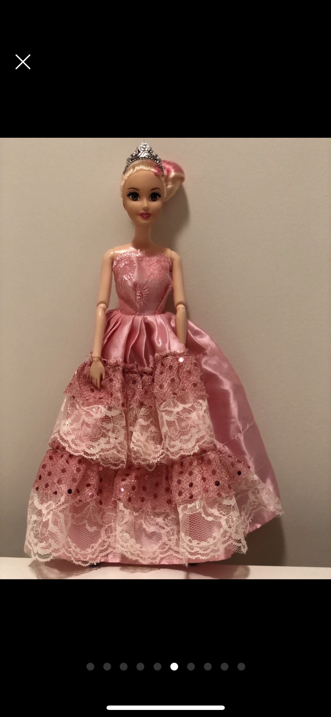 Barbie doll along with 9 exquisite Barbie dresses image indicator(6)