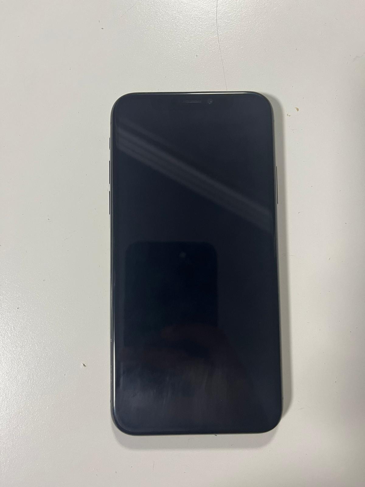 iPhone X with charger, screen protector and phone case
