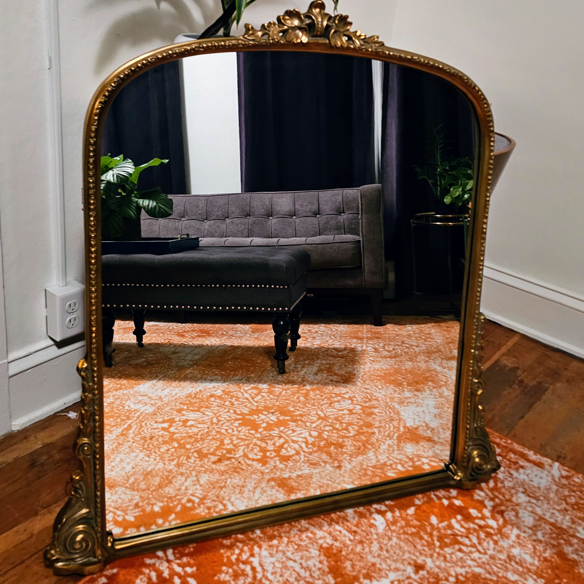 Large ornate gold framed mirror
