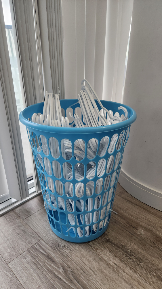 clothes hangers and hamper.