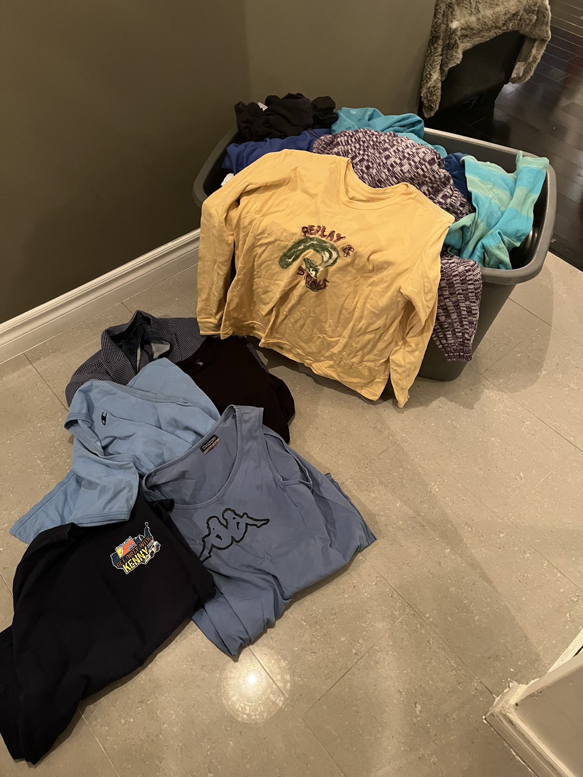 Bin of men’s and women’s vintage clothing