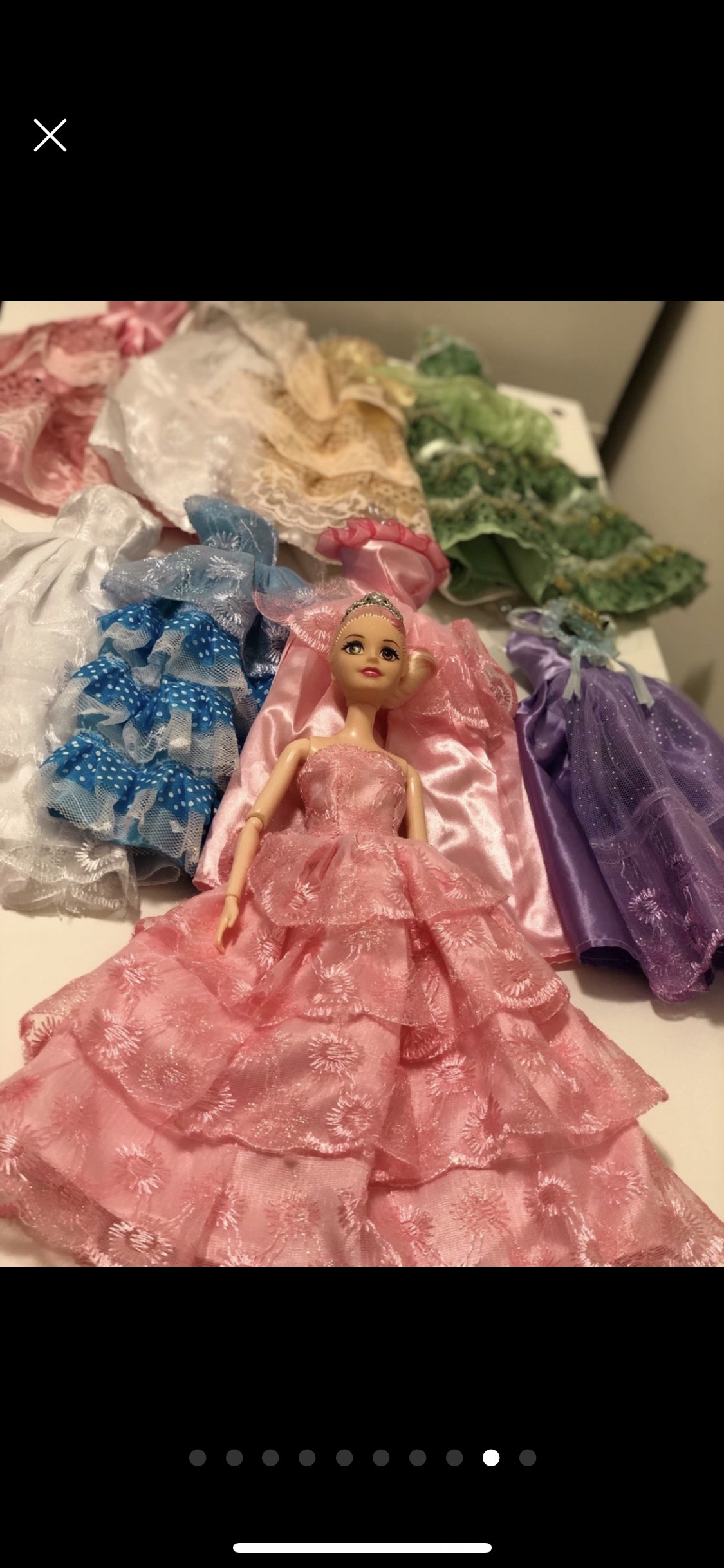 Barbie doll along with 9 exquisite Barbie dresses image indicator(9)