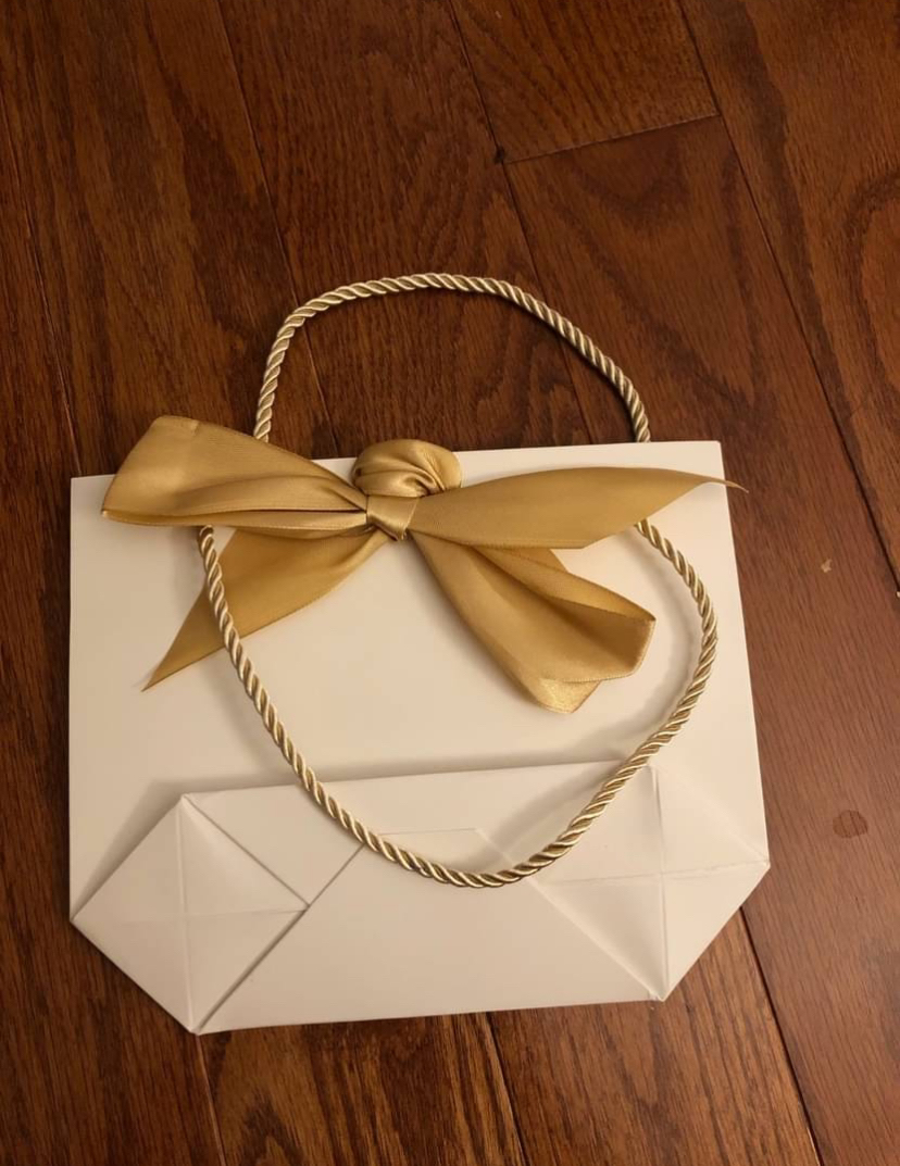 Elegant cream and gold gift bags