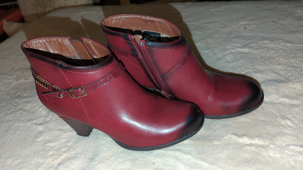 woman's low-cut burgundy boots