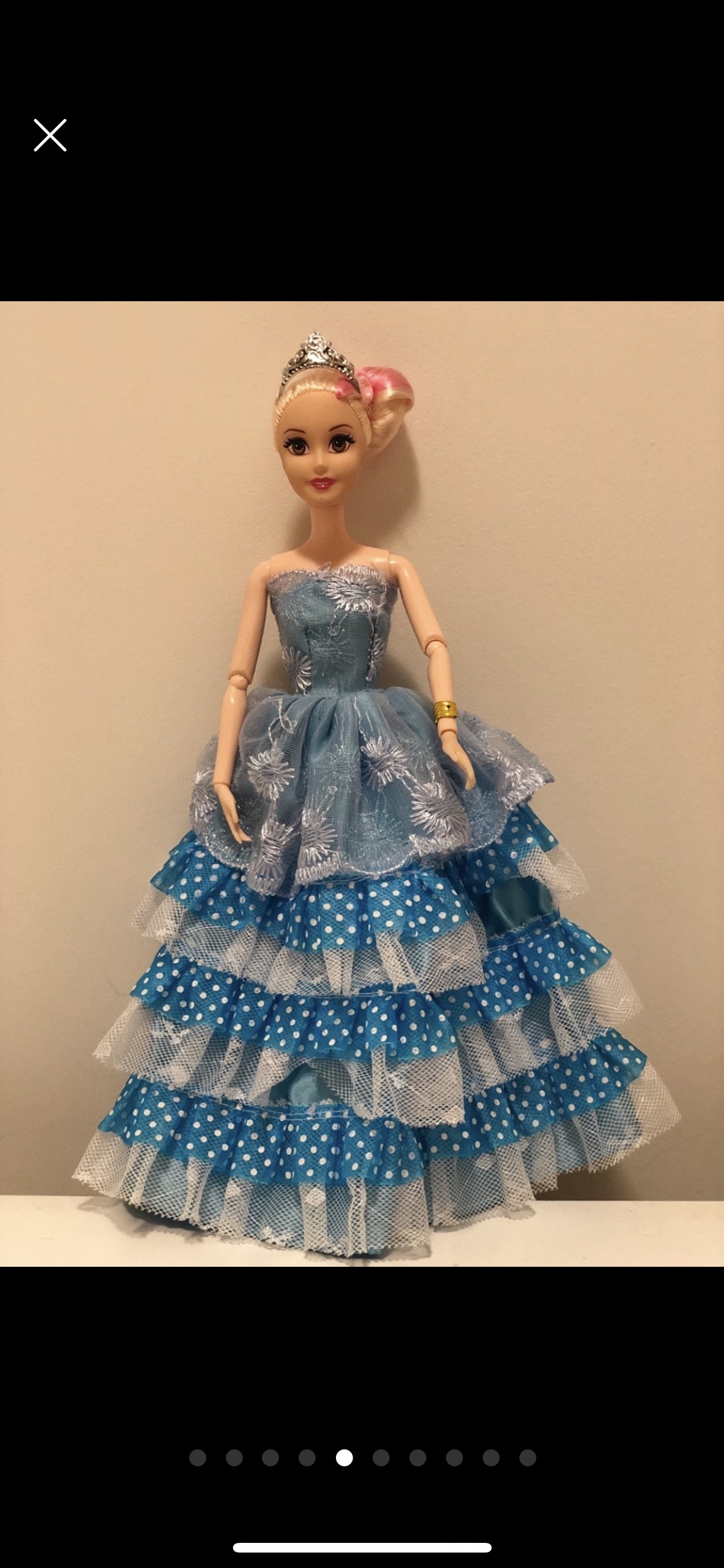 Barbie doll along with 9 exquisite Barbie dresses image indicator(5)