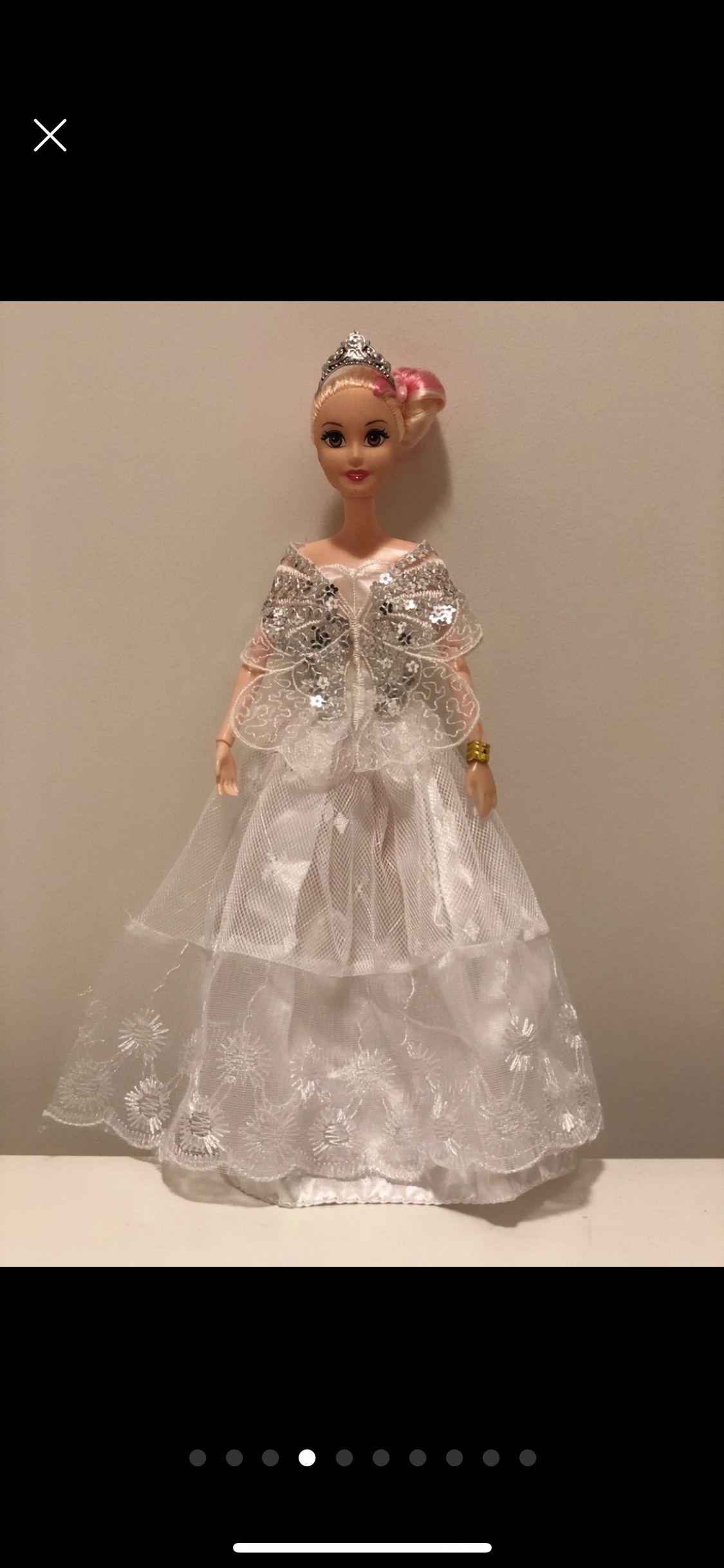 Barbie doll along with 9 exquisite Barbie dresses image indicator(4)